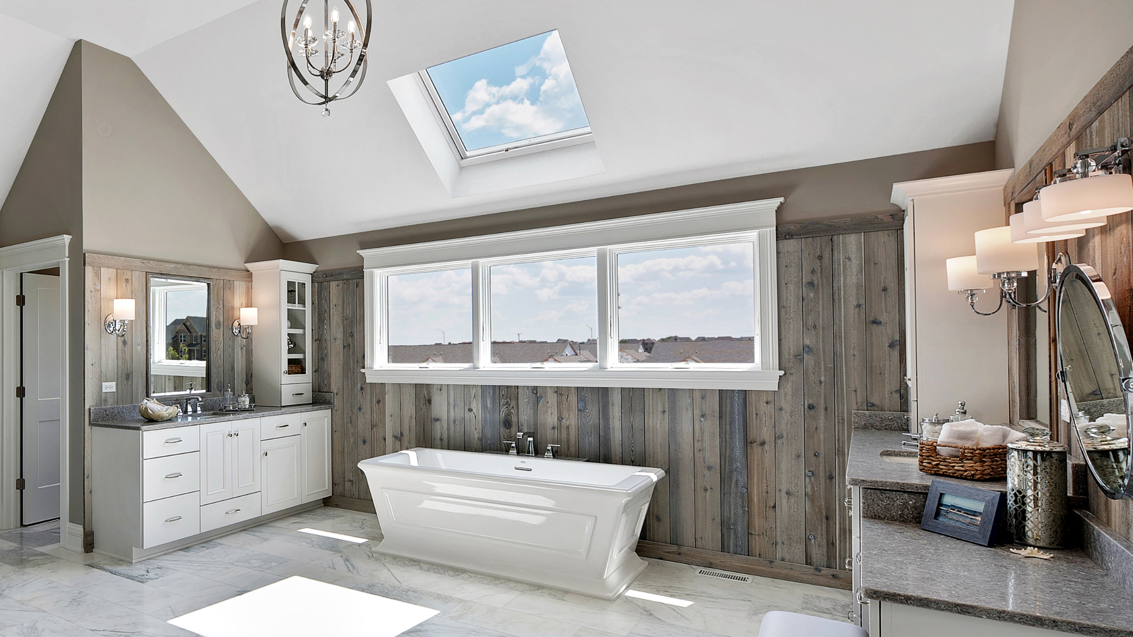 skylights and wood paneling in bathroom